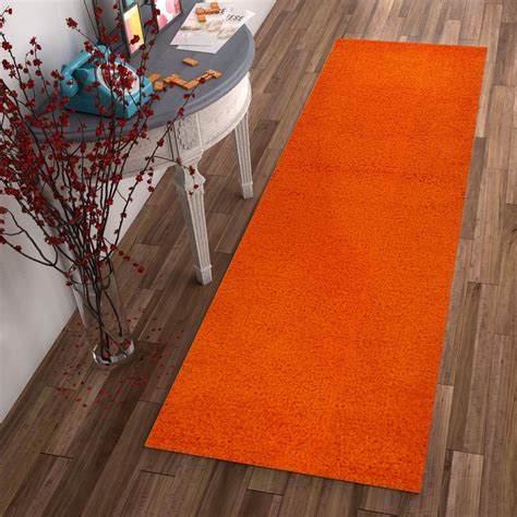Indoor Area Rug. . Orange throw rugs